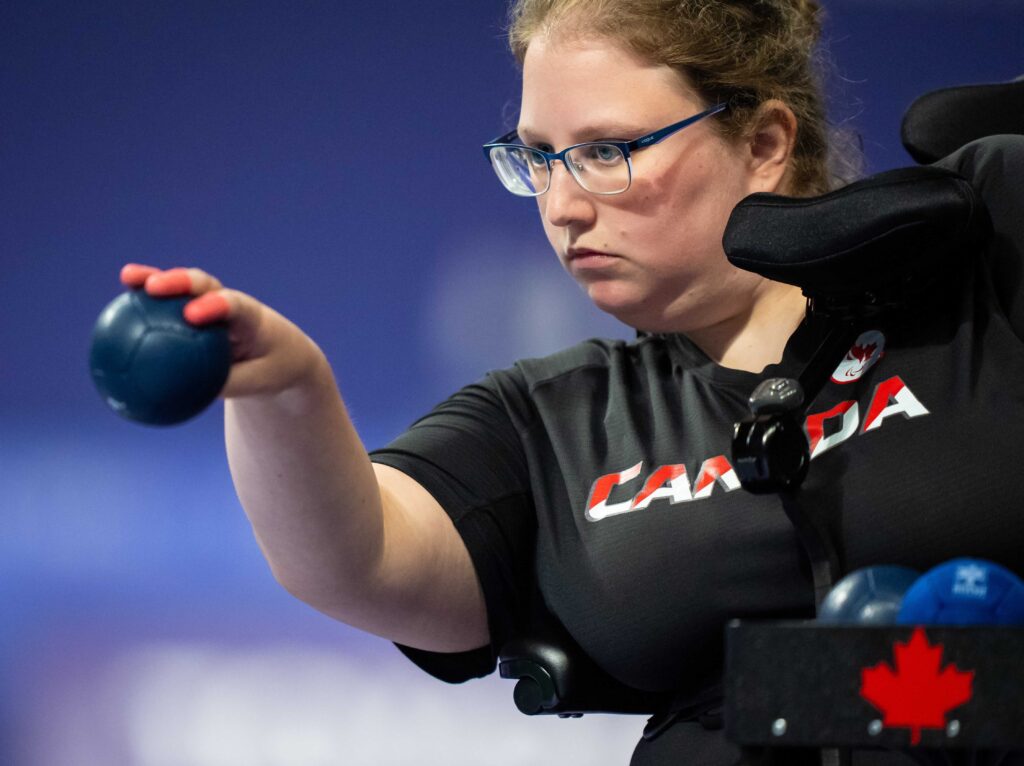 Alison Levine tossing a ball in competition, boccia