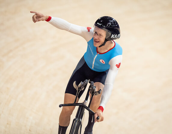 Cyclist Alexandre Hayward points at crowd after his race