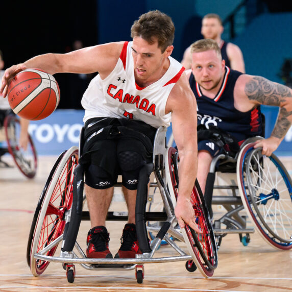 Colin Higgins dribbles past the defender