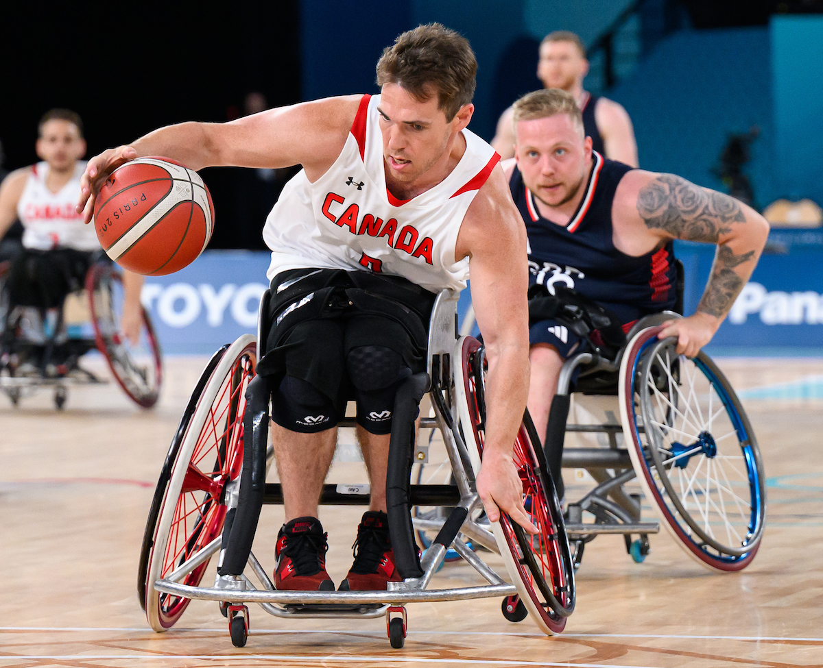 Colin Higgins dribbles past the defender