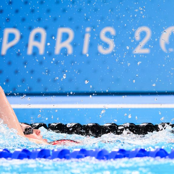 Shelby Newkirk competes for Canada in the Backstroke leg of the 4x100m Medley Relay Final