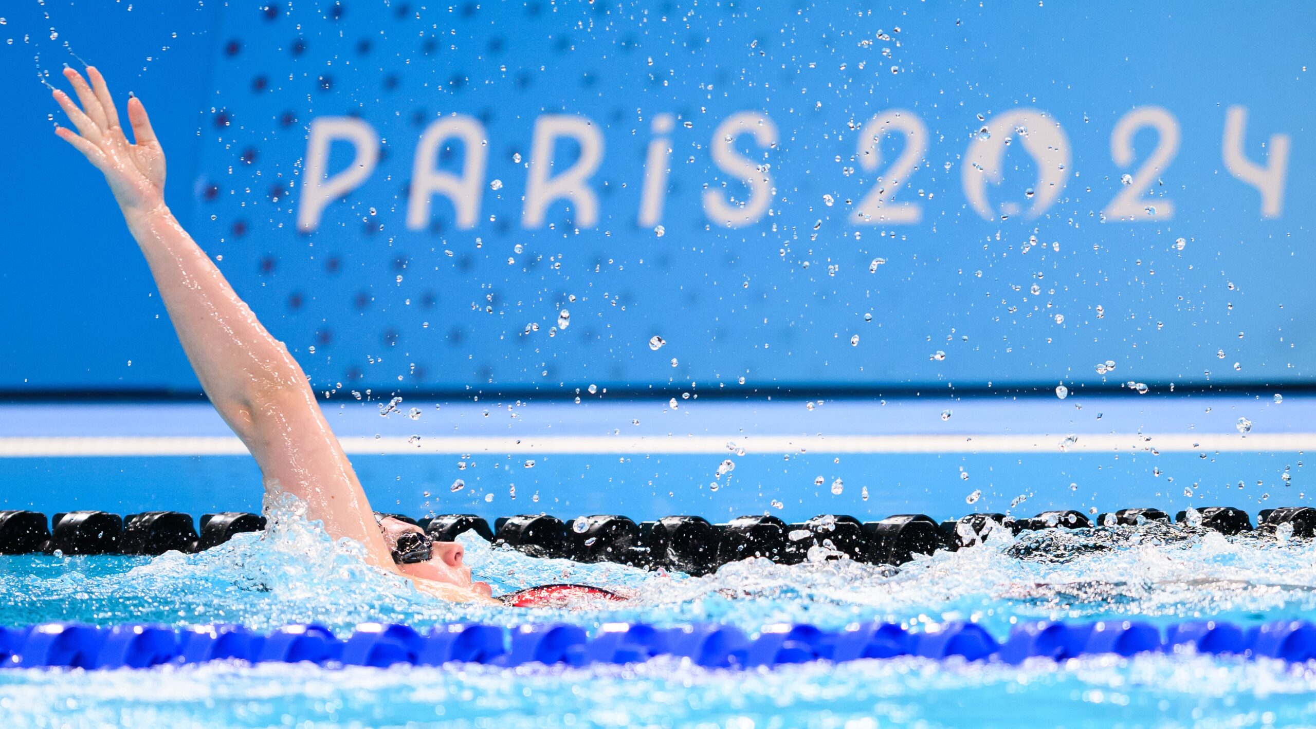 Shelby Newkirk competes for Canada in the Backstroke leg of the 4x100m Medley Relay Final