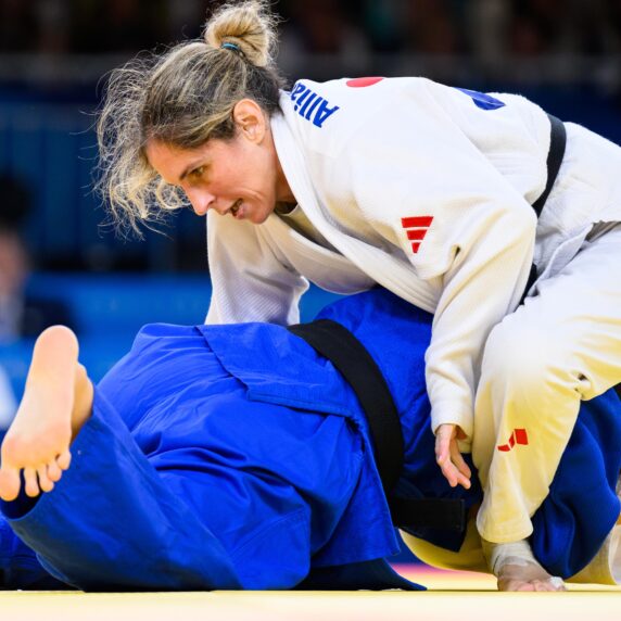 Priscilla Gagne ontop of China's parajudo athlete in the Paris quarter finals