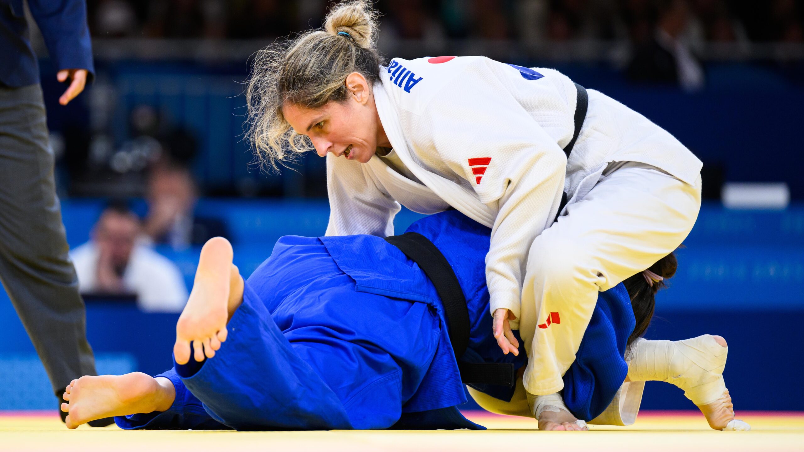 Priscilla Gagne ontop of China's parajudo athlete in the Paris quarter finals