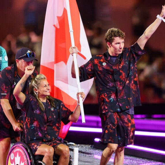 canada's closing ceremony flag bearers walking into the ceremony