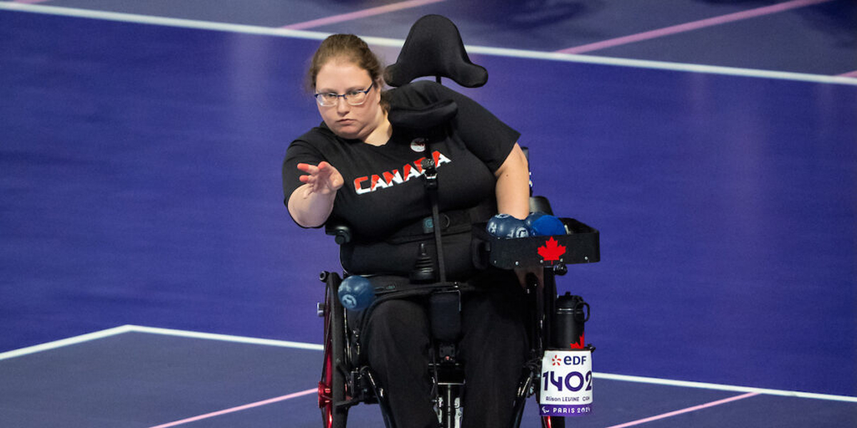 Alison Levine tossing a ball in competition, boccia