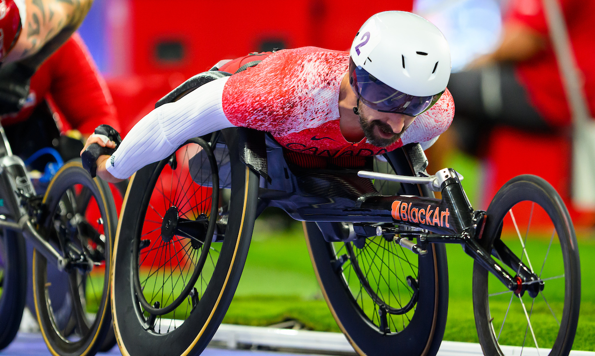 Brent Lakatos with his head forward racing in Paris.