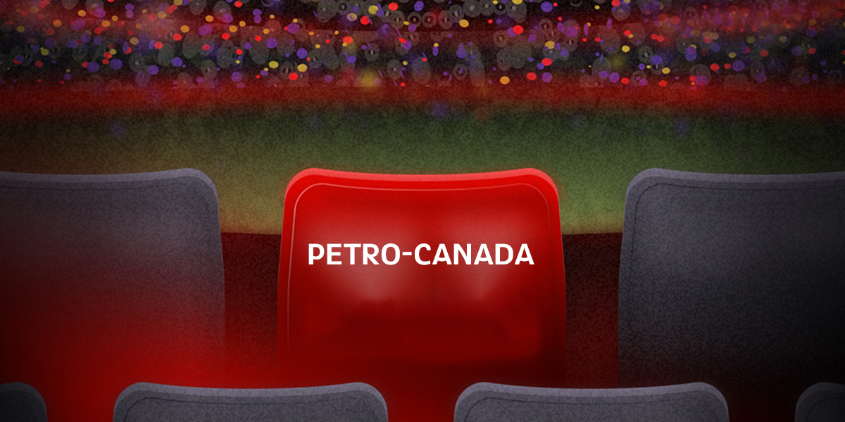 An illustration of a red stadium seat with the Petro-Canada logo prominently displayed, surrounded by empty grey seats. The background shows a blurred stadium crowd with vibrant, multicolored lights.