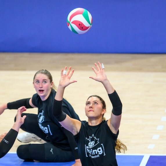 Jennifer Oakes setting the volleyball in practice.