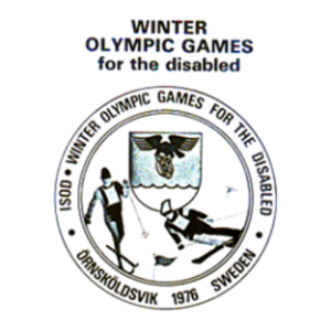 Logo for the 1976 Winter Paralympics in Örnsköldsvik, Sweden. The circular design features text reading 'ISOD Winter Olympic Games for the Disabled' surrounding an illustration of two athletes skiing and sledding on snow, with a central crest symbolizing the event.