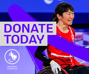 Yuka Chokyu, a Canadian wheelchair table tennis athlete, smiles on the court while competing. A dynamic purple design overlays the image, featuring the Paralympic Foundation of Canada logo and the phrase ‘DONATE TODAY’ in bold text.