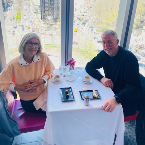 Jim and Deb Westlake Smiling in a Restaurant 