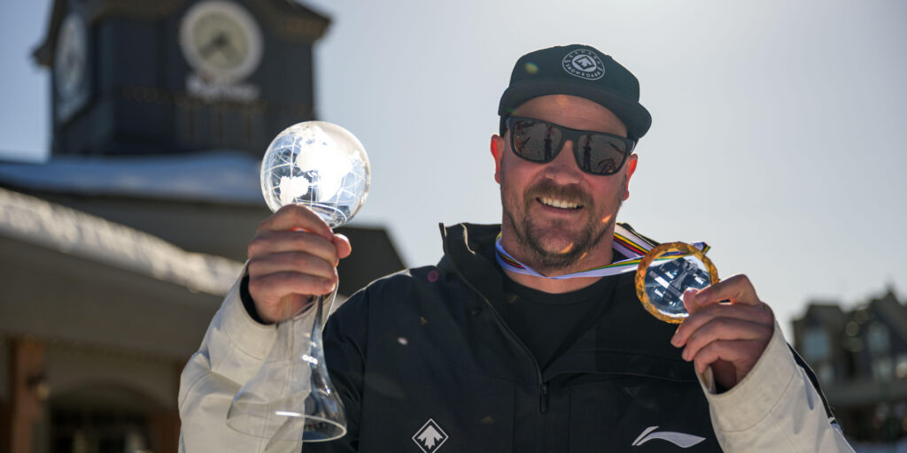 Tyler Turner posing with a medal and trophy