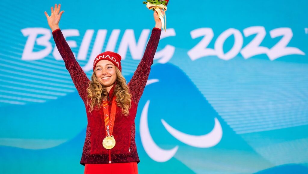 Natalie Wilkie on the podium with a gold medal