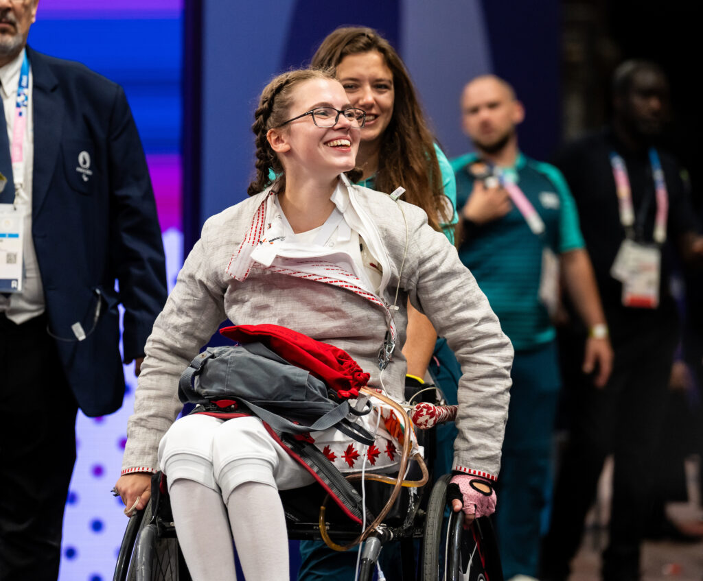 Trinity Lowthian smiling while at a Wheelchair fencing competition at the Paris 2024 Games